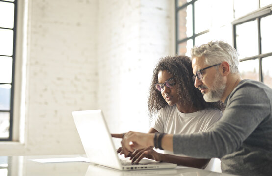 young woman and man work in modern office