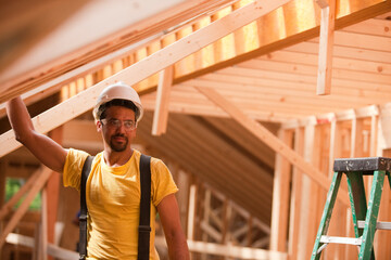 Hispanic carpenter working at a house under construction