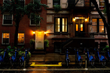 Brownstone house in New York. Typical exterior steps and doors on residential homes in the Chelsea district and Brooklyn in New York City - obrazy, fototapety, plakaty