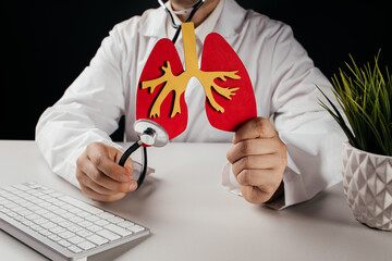 Doctor holding lung organ symbol. Awareness of lung cancer, pneumonia, asthma, COPD, pulmonary...