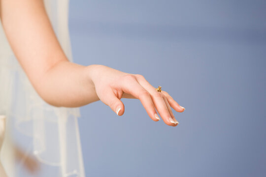 Young bride wearing a wedding ring.