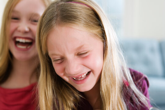 View of two girls laughing.