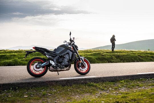 Peaceful view with young rider and his motorcycle