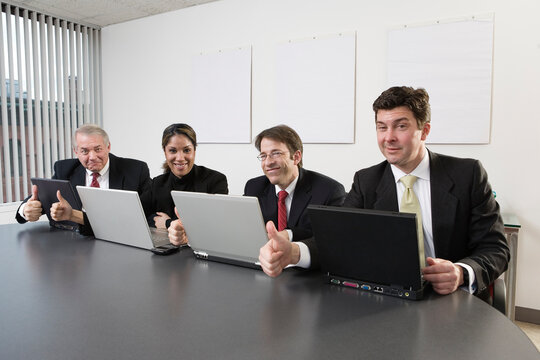 Portrait of business people gesturing.