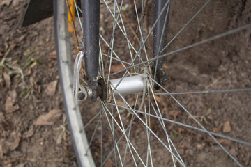 Front wheel of a spoked bicycle close-up