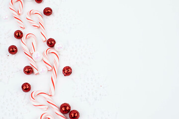 Candy Canes with snowflakes on white background with room for text