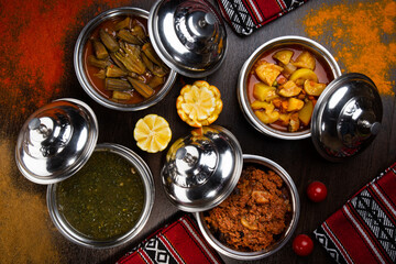 Assorted indian food with alu mutter, bhindi, keema, palak, saag and bhutta served in dish isolated on table top view of arabic food