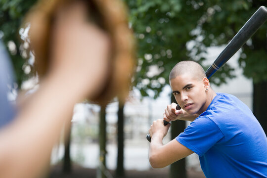 Portrait of a teenage boy holding a baseball bat