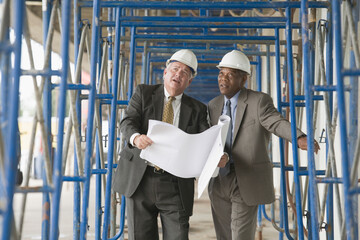 Two engineers discussing at a construction site