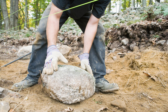Man building stone wall