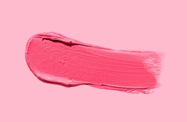 Lipstick or blusher abstract strokes smudges  background texture multi colored red blush isolated on coral background