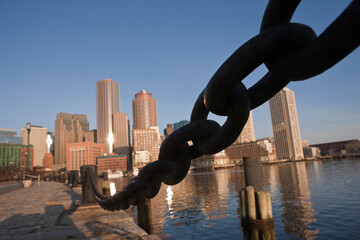 Anchor chain with city skyline in background, Rowes Wharf, Boston Harbor, Boston, Massachusetts, USA