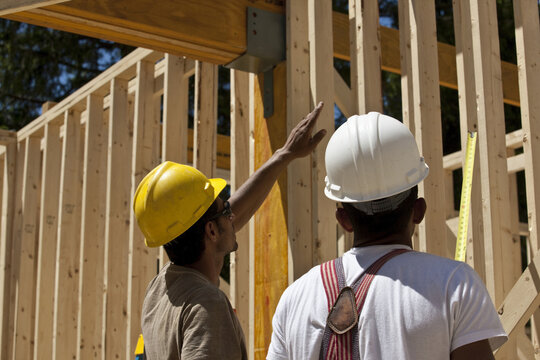 Carpenters planning at a construction site
