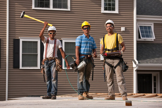 Carpenters working with construction tools