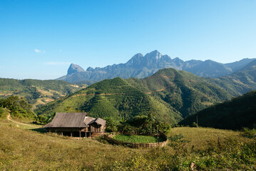 Wooden house in green valley