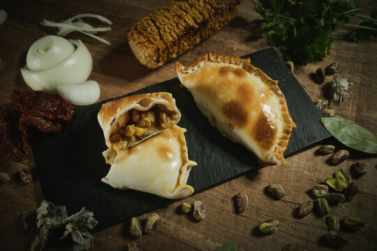 Delicious argentinian empanadas served on table in kitchen