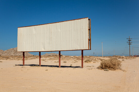 Blank Billboard In The Middle Of Desert Landscape