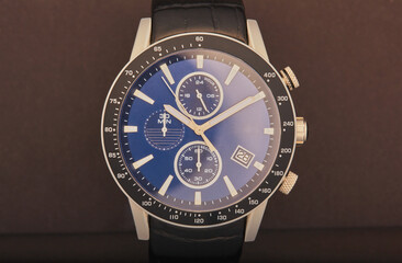 Luxury wrist watch on a black background.