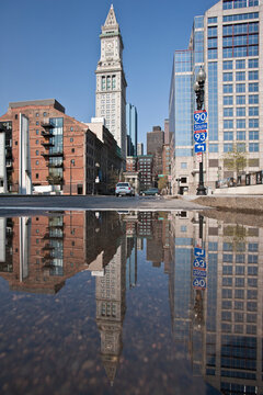 Custom House Tower reflected in a puddle at Rose Kennedy Greenway, Boston, Massachusetts, USA