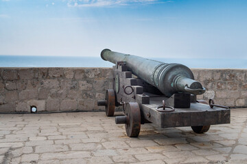 Fototapeta na wymiar An old cannon on the walled city of Dubrovnik in Croatia