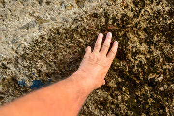 Touching the Gatun locks wall on the Panama canal for good luck