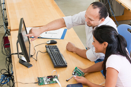Engineering students at computer using in-circuit emulator