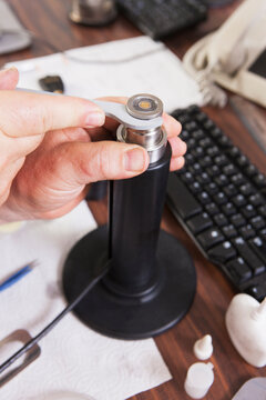 Engineer putting on retaining ring in an O2 electrochemical sensor probe in a laboratory