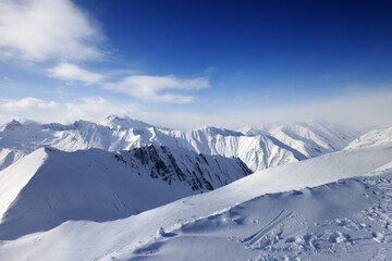 Fototapeta na wymiar Snowy mountains and blue sky
