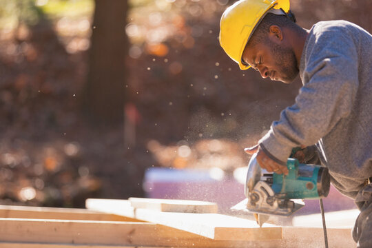 Carpenter cutting bevels using a circular saw