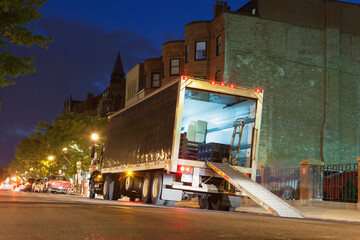 Unloading service truck at dusk, Newbury Street, Boston, Massachusetts, USA