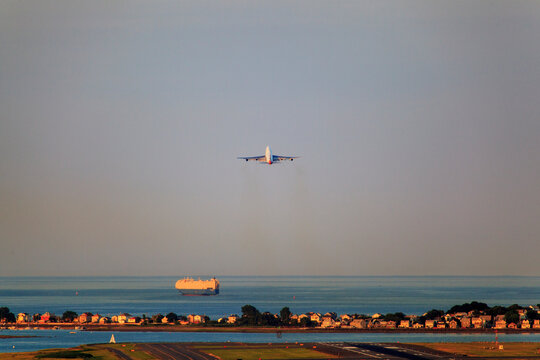 Plane taking off from Logan Airport with Winthrop, Boston, Massachusetts, USA