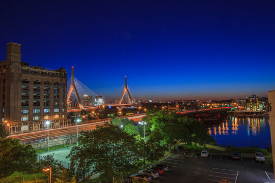 City lit up at dusk, Leonard P. Zakim Bunker Hill Bridge, North End, Boston, Massachusetts, USA