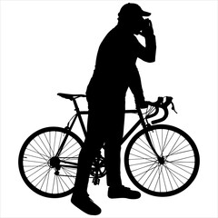 A cyclist in a cap holds his bike behind the wheel. The man calls raised his hand to his mouth and calls someone. Side view of both the bike and the person. Black male silhouette isolated on white