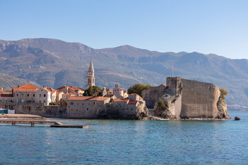 Panoramic view of the medieval old town of the tourist coastal city of Budva, Montenegro, Adriatic Mediterranean Sea, Montenegro, Balkan, Europe. Dinaric Alps along the Budvanian riviera in the back