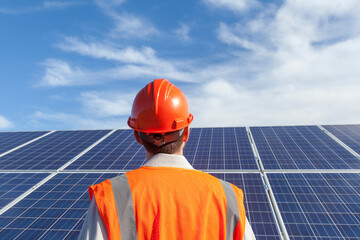 Solar photovoltaic installer examining racking for a PV array