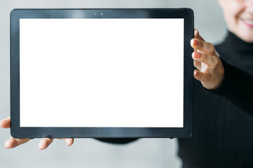 Digital mockup. Advertising background. Mobile technology. Unrecognizable woman holding tablet computer with blank screen.