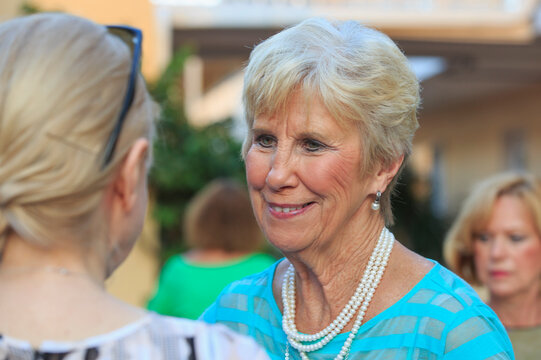 Senior woman connects with a younger woman