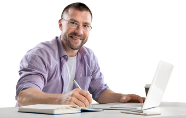 Happy cheerful businessman working on a laptop in office.