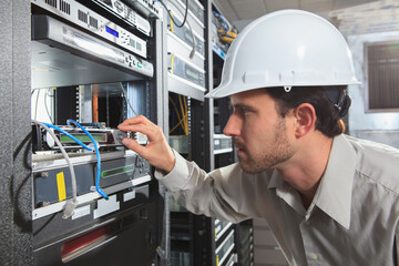 Network engineer working in a server room