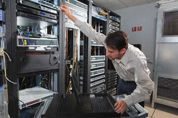 Network engineer configuring a data switch