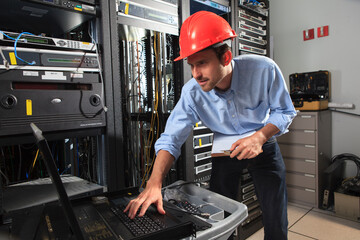 Network engineer entering switch configuration data