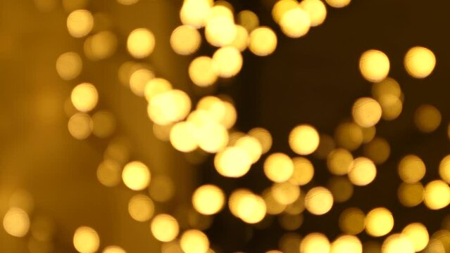 Christmas abstract golden brown defocused blur bokeh light background, 4K video background
