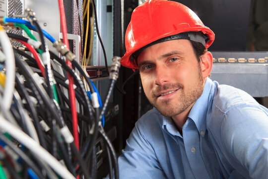 Network engineer at cable distribution patch panel
