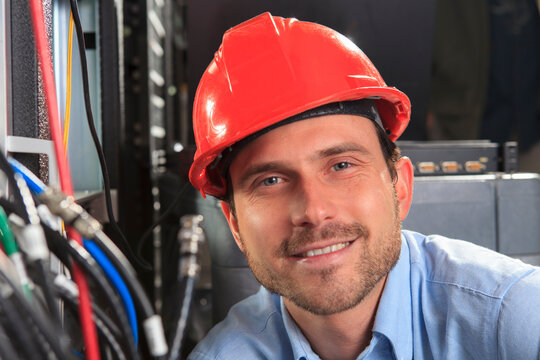 Network engineer at cable distribution patch panel