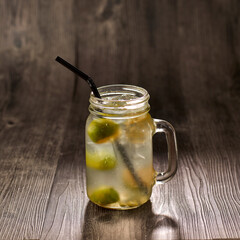 Lime Water with straw served in glass isolated on table side view healthy morning drink