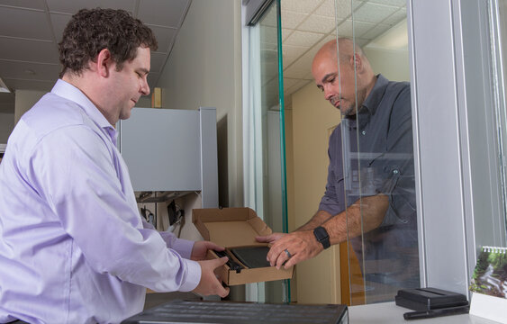 Customer service agent exchanging a new set top box for a customer