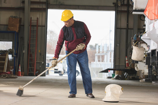 Maintenance supervisor cleaning utility garage