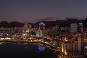 panoramic aerial night view of the old and modern buildings at Waterfront in Port Louis, Capital of...