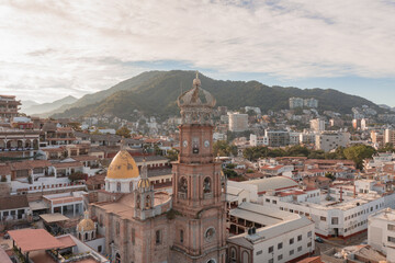 Fototapeta na wymiar Puerto Vallarta boardwalk with an impressive view of Iglesia Villa de Guadalupe the icon of the city