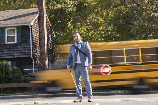 Businessman with Visual Impairment outside with his cane